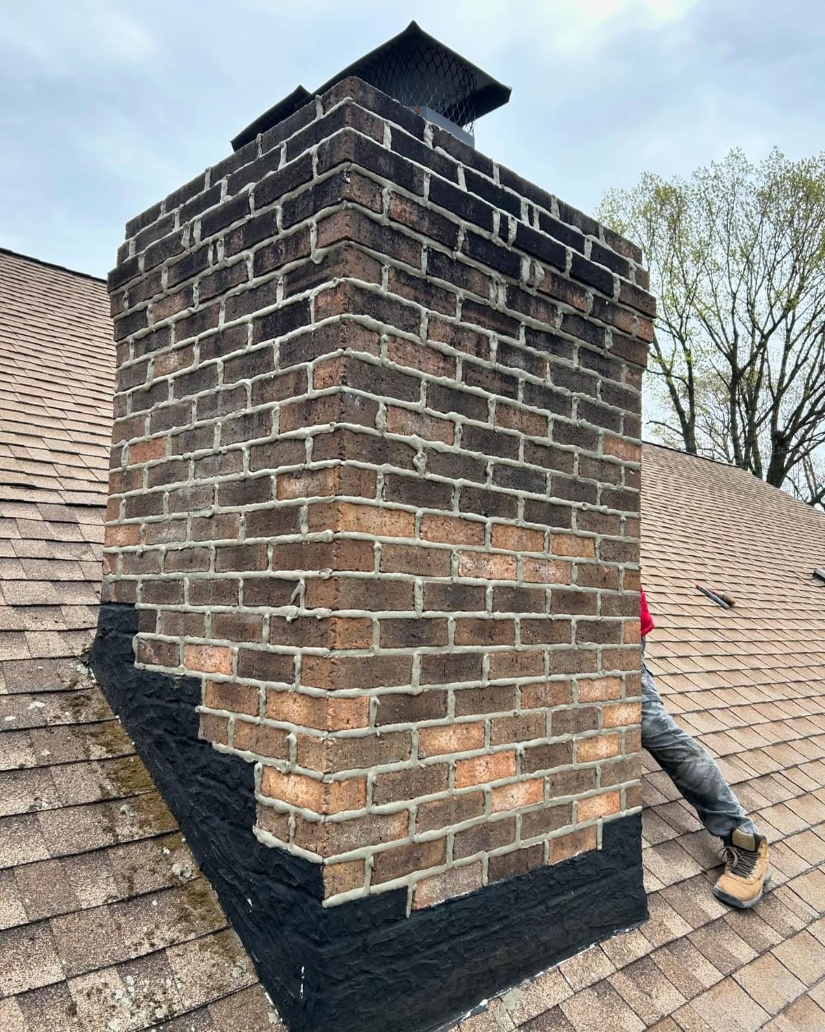 Brick chimney with newly repaired flashing