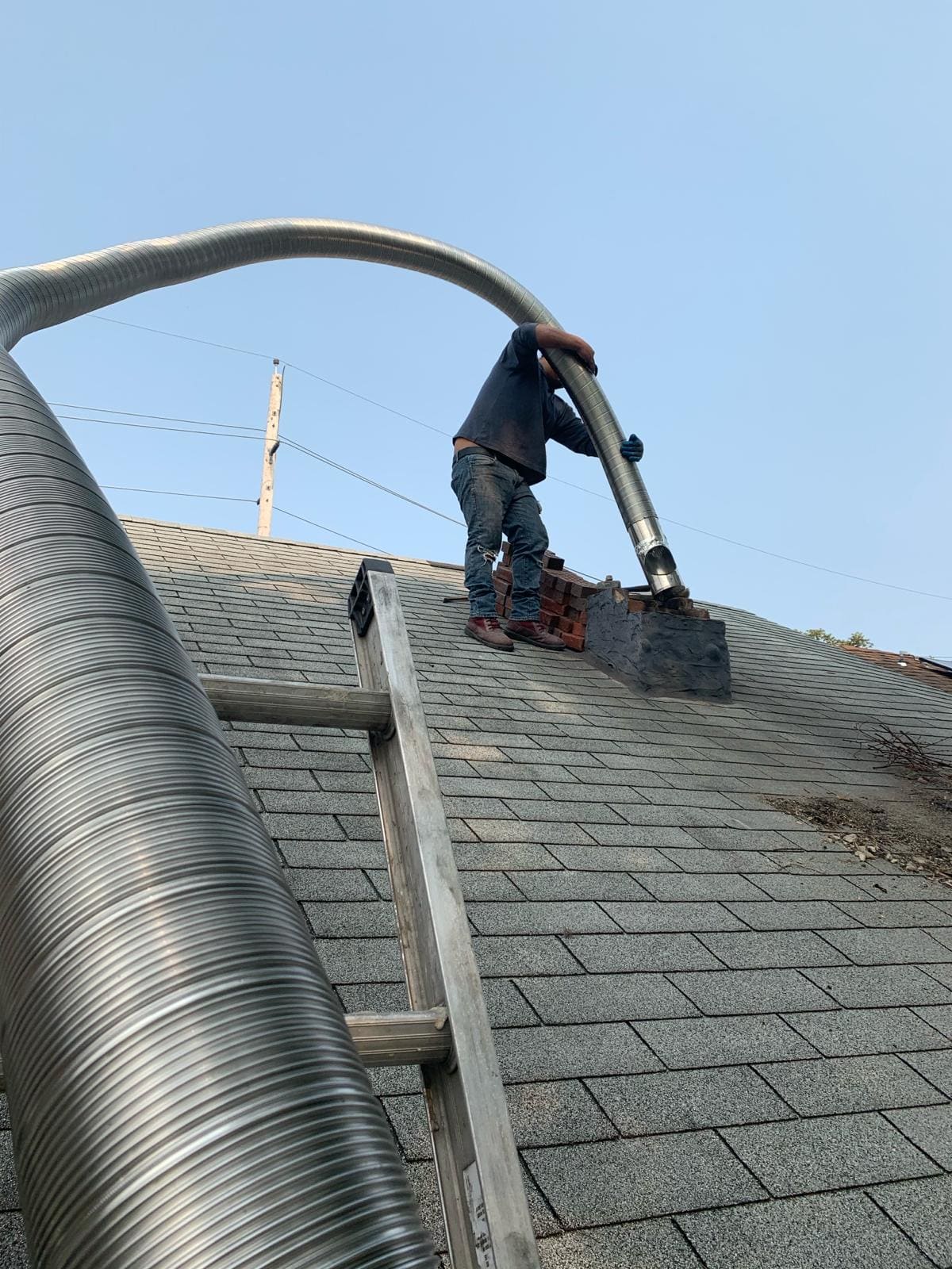 Brick chimney rebuild completed by Asset Roofing & Chimney