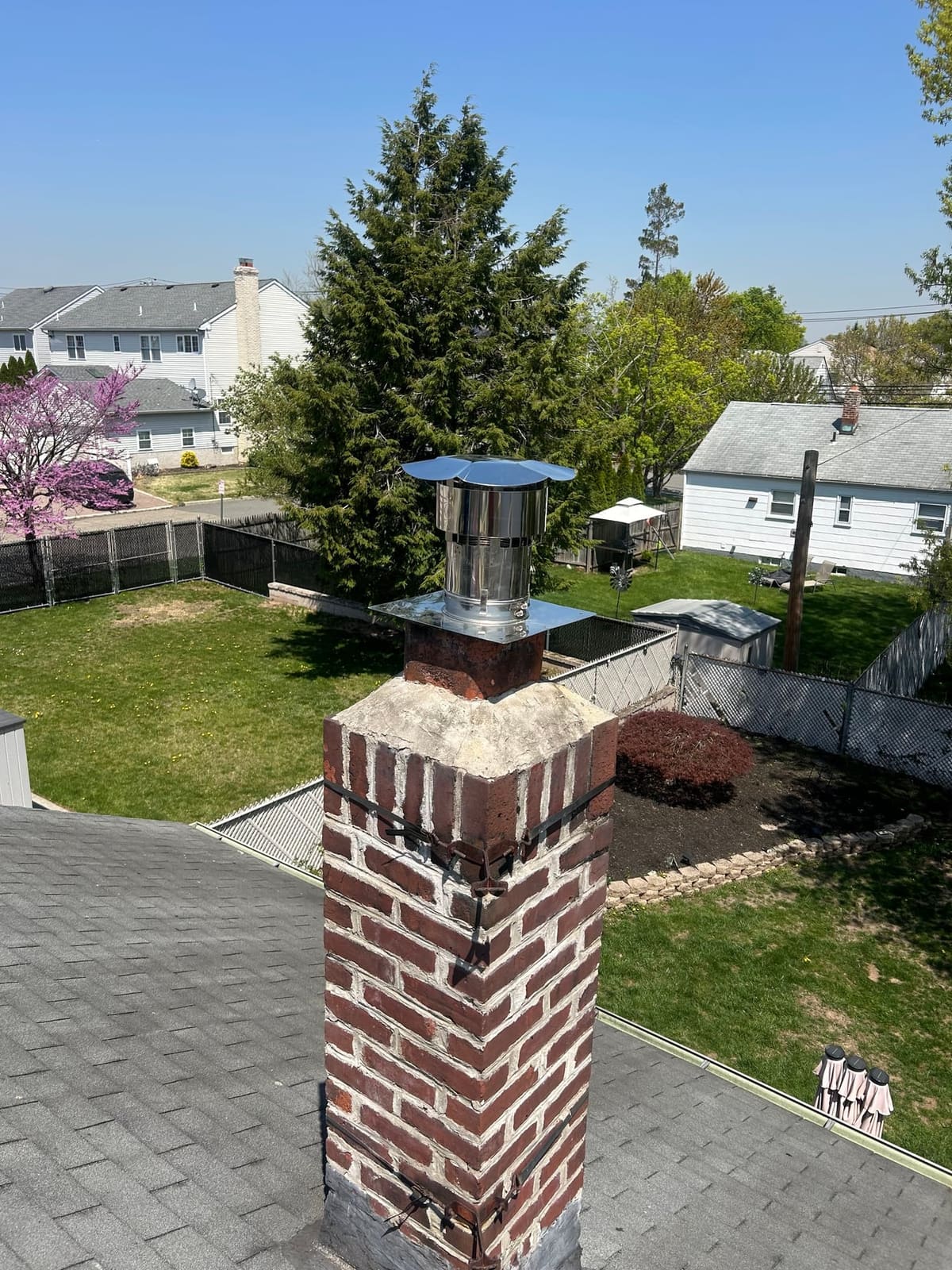 Rebuilt brick chimney with a new crown and stainless cap