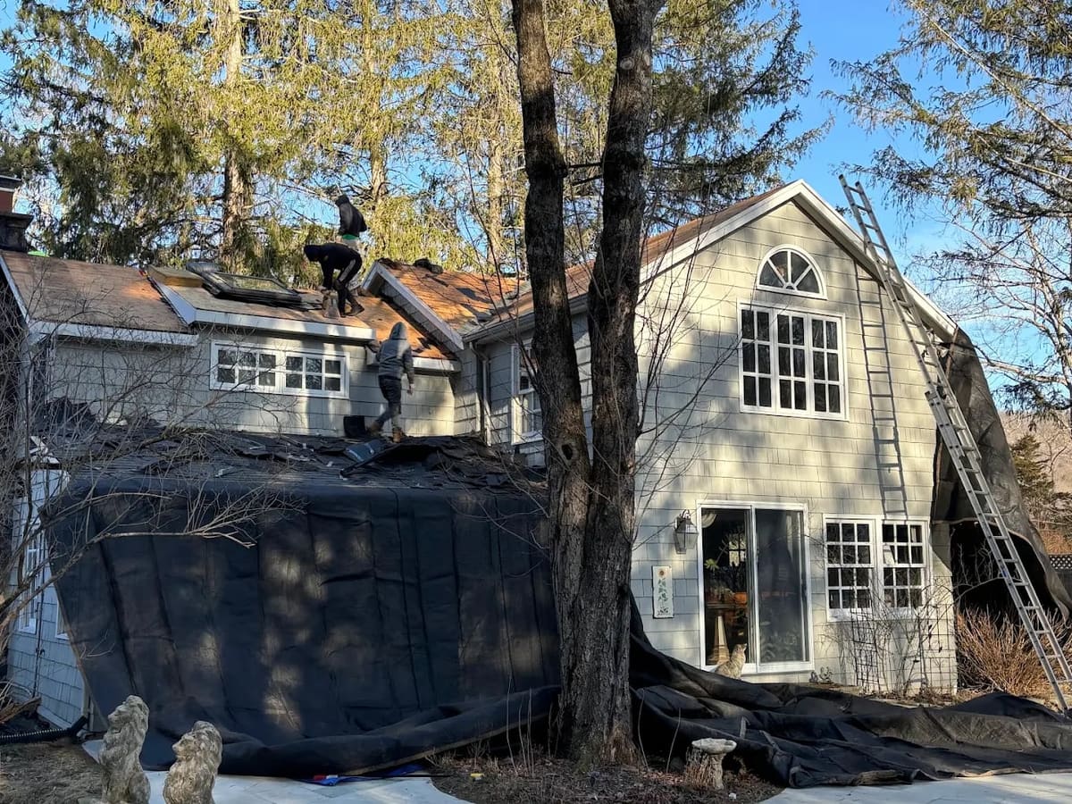 Roof replacement around a dormer on a two-story home