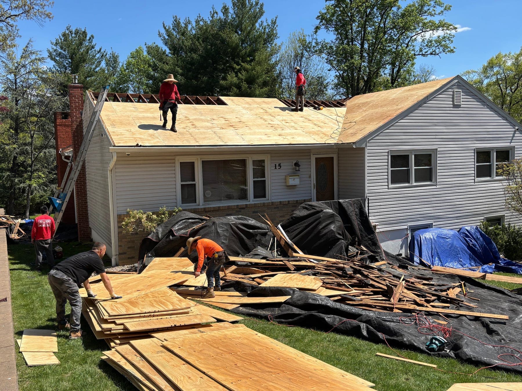 Full roof tear-off with crew and debris protection on a ranch home