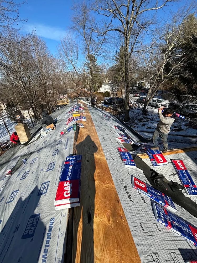 Underlayment installed through a roof valley before shingles